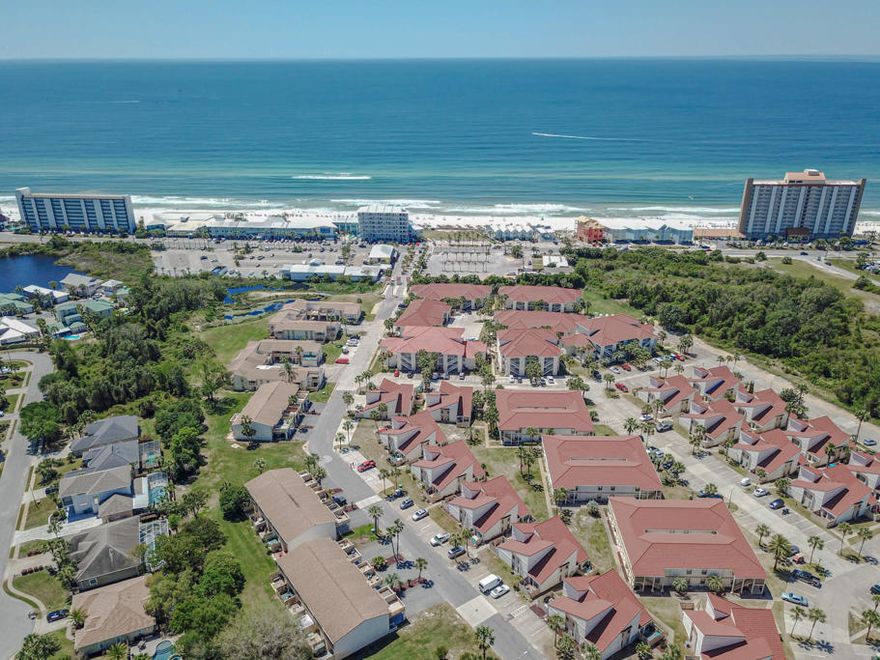 'CURRENTLY UNDER CONTRACT, SELLER ACCEPTING BACKUP OFFERS' You will love this 2 bedroom 2 bathroom unit at Horizon South. You have 2 spacious balconies for each bedroom where you can enjoy your mornings relaxing. There is a patio downstairs that has a wonderful lush common area to play with the kids. You can also grill your dinner on the patio. New pavers have recently been added to the back deck. This is a great deal for that special beach dream home or investment property. Horizon South is a great vacation destination because of its location which is walking distance to the beach in a gated community. The location is ideal, nestled between Hwy 98 and Front Beach Rd., close to Pier Park with its shopping and restaurants. Amenities that include 4 Outdoor Pools, Beach Access, Hot Tub, Fitness Room, Tennis, Mini Golf, Basketball Court, Horseshoe Pit, Volleyball Court, Shuffleboard, Ground Keeping and Exterior Repairs from the HOA and Golf Cart friendly. There are also outdoor storage closets for you to store your beach gear.