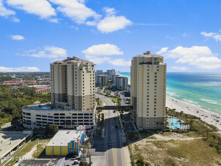 PERFECT 2nd floor location in the beachfront building of Grand Panama Beach Resort - awesome pool, beach AND gulf of Mexico view!! Located in the 7th stack, unit 207 offers a LARGE balcony - all can dine or toast the day together. This 2-bedroom, 2-bathroom floor plan has a nook for bunk or trundle beds maximizing the sleeping space for 8 guests. Tile throughout, newer HVAC (4 years), and water heater (6 years), furnished and rental ready with 2022 rental income of $45k. Priced to SELL!! Original owners have enjoyed much family time in their condo and now it is time for new ventures. Grand Panama Resort amenities include multiple pools (one seasonally heated), hot tub, fitness center, grill areas, Tiki Bar, onsite convenience store, parking garage and onsite rental.