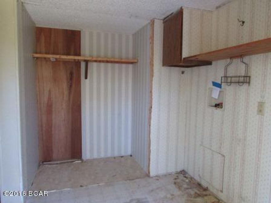 3 Bedroom 2 Bath Mobile Home that needs some work. The value is in the 40 acres. Wooded lot that sits in the Country!! This is priced to SELL so call today for more information