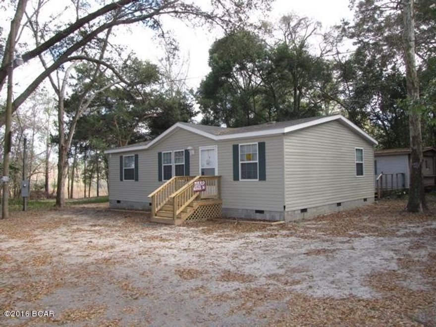 RENOVATED - LIKE NEW CONDITION 3 Bedroom 2 Bath with possible SELLER FINANCING. This Great 2011 Nobility Modular Home is Conveniently Located to Downtown PC, Callaway, Tyndall, etc just a couple of blocks off Bus Hwy 98 and a few blocks East of Watson Bayou, and affords privacy because it is at the very end of 7th St. All new Wood Look vinyl flooring, Carpet in Master Bedroom, freshly painted walls, new Stove & Dishwasher, and even has new Fabric Window Treatments on windows. Nice quiet location with views to the East across some Wetlands. Only a couple of blocks from Joe Moody Harris Park. This home has City Water, Sewer, and Garbage pick-up, and has Alarm System installed. There is also an older Mobile Home on this property that can be used however owner desires. DON'T MISS THIS ONE  !!