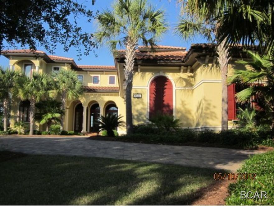 WATERFRONT with Dock in PREMIER FINISTERRE. This has been a second home and in like new condition. Master on the Main Floor with view of water. Beautiful Executive home with a huge Grand Room off the kitchen with Marble fireplace with gas logs.A full wall of built in shelves!! Kitchen has Quartz counters and under counter lighting. Scored concrete floors that are absolute unbelievable beautiful! 3 Car Garage with additional room for a motorcyle or golf cart too!A large circular paver drive is a wonderful advantage. The owner had storage room with 6' headroom over the garage area so storage in this home is so much more than any other home I have ever seen. Closets, Closets and more closets. Beautiful stone like stair steps. NO CARPET in this house anywhere. Beautiful hardwood