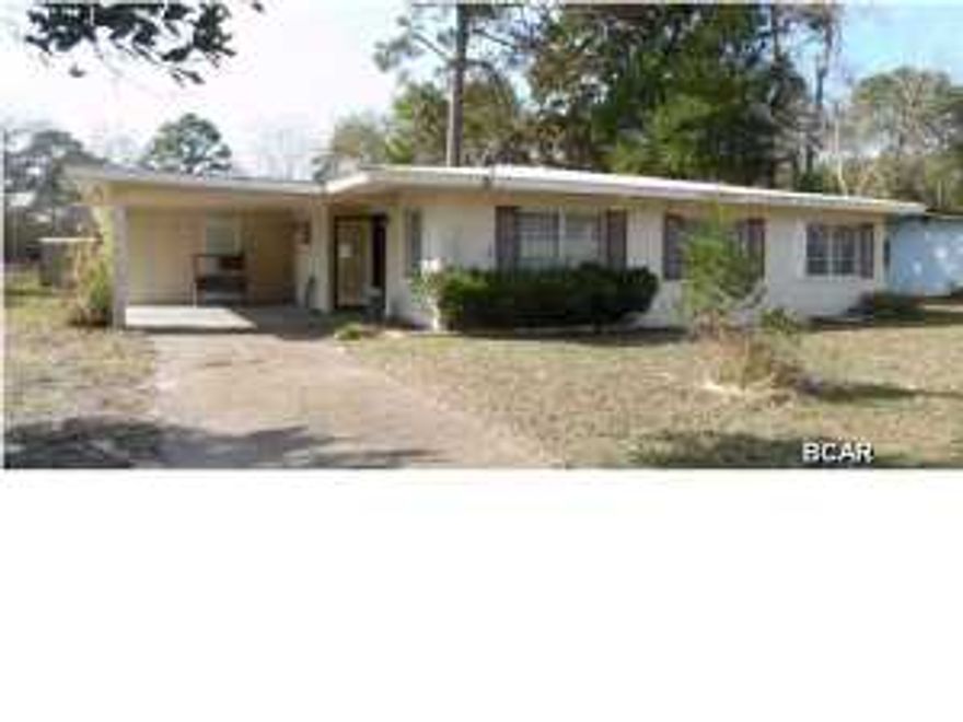 Submit all Highest and Best offers by Friday 1/2/15 at 4 pm. Don't miss this opportunity to own a sturdy, block home in Port St Joe, only a few blocks from the Bay. This home has 3 bedrooms and 1 bath, with a large kitchen/dining/den across the rear of the house. The exterior boasts covered parking with an oversized carport and a large back yard, big enough for pool and lots of decking. Sold As is, where is.