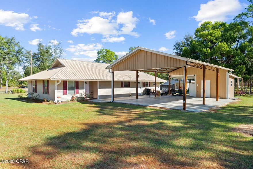 Welcome to your private slice of country living at 13816 Fiddlers Green Rd—an exceptional multi-use property set on over 2 acres, featuring a spacious main home, a fully equipped apartment, and an incredible workshop setup you won't find anywhere else.

The main residence offers warm, comfortable living with an inviting layout, large living room with tray ceilings, and a charming galley-style kitchen with abundant cabinetry, solid surface countertops, and a walk-in pantry. Multiple living and dining spaces make this home ideal for entertaining or spreading out. The main house is 2-bedrooms and 1693 sqft.

Tucked just steps away is a separate apartment—perfect for multigenerational living, guests, rental income, or a private home office. With its own full kitchen, living area, bathroom, and laundry space, it's truly move-in ready. Apartment is 2-bedroom and 1204 sqft.

Outside is where this property becomes something truly special. A massive pole barn with loft provides outstanding workspace, storage, and hobby potential. Whether you're a craftsman, mechanic, boater, or outdoor enthusiast, this setup checks every box. The barn includes enclosed workshop space, overhead storage, and multiple covered bays. An additional open-air storage garage offers even more room for equipment, trailers, RVs, or outdoor toys.

With plenty of cleared yard space, mature trees, and a peaceful rural setting, this homesite offers the perfect blend of privacy and functionality—all while still being within a short drive to town, schools, and amenities.

If you've been searching for land, flexibility, and endless possibilities, this property delivers it all. Schedule your private tour today.