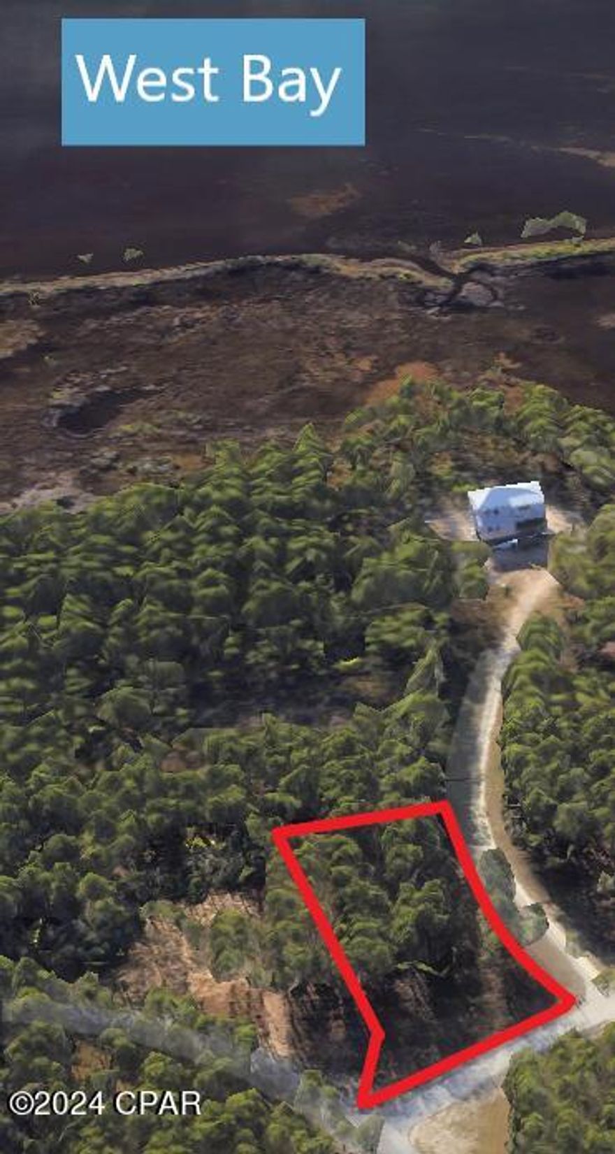 3/4 acre lot with a beautiful distant view of West Bay. Paved road to the property line. Large, buildable area. Tremendous opportunity to build your dream home in one of Panama City Beach's most sought after, waterfront gated communities at an 
exceptional price! RiverCamps is conveniently located away from the crowds and traffic yet only 10 miles from Pier Park and the white sandy beaches of PCB and less than 10 minutes from NW Florida Beaches International Airport. This gated 1500 acre oasis will have less than 450 homes with 1000 acres committed to conservation. Surrounded by 18,000 acre West Bay, the Intracoastal Waterway and Crooked Creek you can be at Shell Island and the Gulf of Mexico by boat in 30 minutes. Owners enjoy a community boat ramp, dry boat storage and day-use boat slips. 7 miles of trails and boardwalks to hike, bike and explore. An owners-only campground with adult and kid tent on Crooked Creek with restrooms and showers. Rebuild of amenities is underway and will include a swimming pool and fitness center when completed.