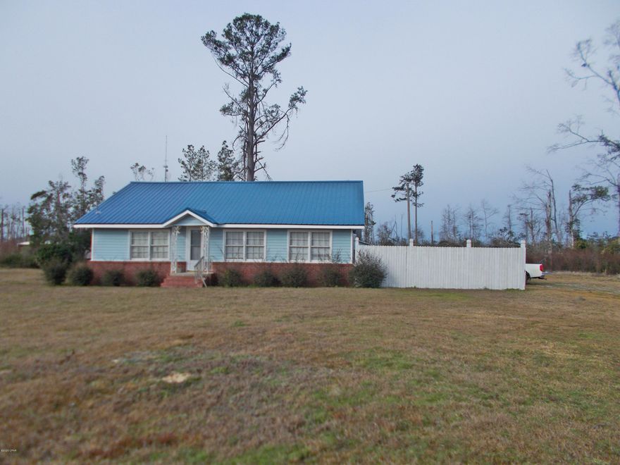 Two story home with a new metal roof close to town with over 6 ac of land, this home has a large living room, a formal dining room, breakfast area and a large master bedroom, master bath has a walk in tile shower, double sink vanity and a large walk in closet,  there are an additional 2 bedrooms upstairs and an office or play room. With a little TLC it would be a very nice home. Call agent to view it today.