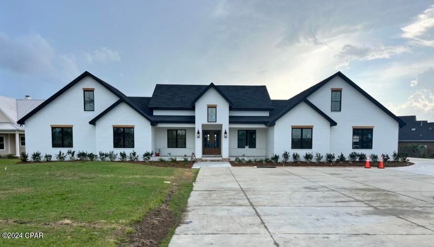 New construction waterfront home on 1.25 acres with 100' water frontage. This home features 12' ceilings, brick exterior and a 3-car garage. The floorplan includes 5 bedrooms, 4 full bathrooms, 2 half bathrooms, home office, bonus room and a primary suite on the main level waterfront. The home features custom cabinetry, a covered back porch with gas fireplace, and many custom finishes throughout. Entered for comp purposes only.