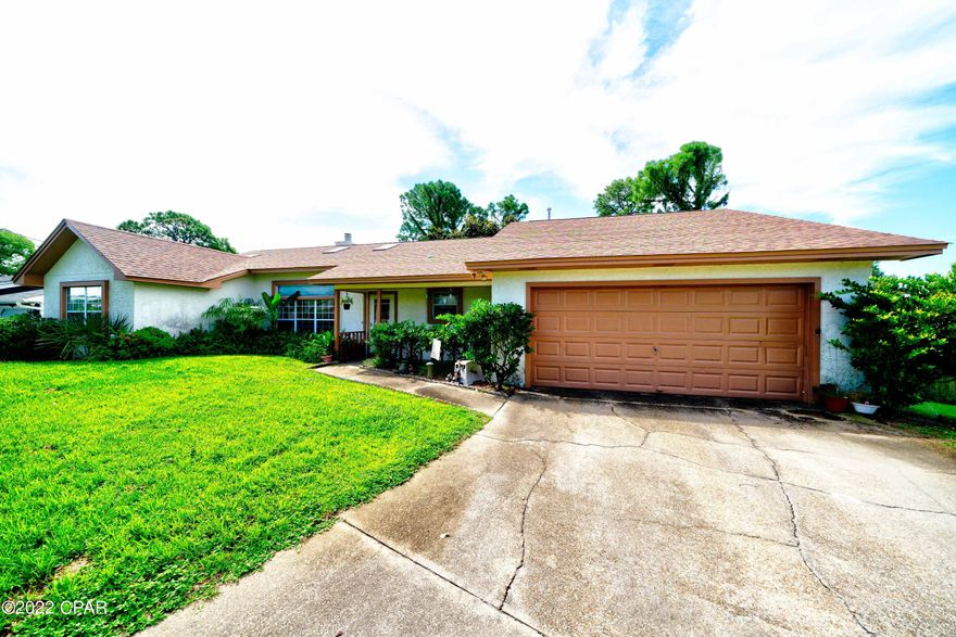 220 Scooter Drive - A short commute to Thomas Drive, Navy Base, St. Andrew's State Park, Boat Ramp, Gulf of Mexico. Single-story living offers ease and convenience, appealing 3-bedroom, 2-bathroom ranch-style home in the North Lagoon Heights. Exteriors include pressure-treated deck w/ privacy fence and front porch. Cross the threshold into a warm welcome that includes a Florida room, wood burning fireplace in the living room, open to dining and kitchen. The serene master bedroom consists of a walk-in closet. The other two bedrooms are unique, quiet, and rich with ample wardrobe storage. Attached two-car garage, 3yr old roof, 2yr old HVAC, washer and dryer to remain. Located off North Lagoon, a quiet community, Enjoy salt air without the crowds. Visit today and get your offer ready!
