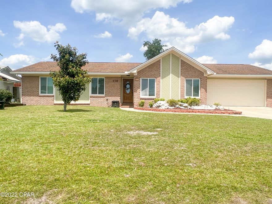 Don't miss this beautiful move in ready home in the prestigious Derby Woods neighborhood in Lynn Haven.  This 3 bedroom, 2 bath charmer includes wood plank/tile flooring, new hot tub, new water heater, new windows, new hurricane wind-rated garage door, cathedral ceiling, updated kitchen and hurricane shutters for the entire house.  The open floor plan includes a formal dining area, large living room, den/office with pocket door that can be closed for privacy with wood burning fireplace, kitchen with breakfast nook, spacious master suite and two additional large bedrooms on the other side of the hallway.  The landscaped backyard is picture perfect with a covered patio, expansive deck, fire-pit, gardens and hot tub.  There is also plenty of room for a pool. Washer and Dryer convey.