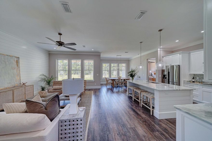 CURRENTLY UNDER CONTRACT, SELLER ACCEPTING BACKUP OFFERS. You get to CHOOSE your View!

Enjoy the serenity of Dolphin Bay ~ Established, gated community with great amenities, nestled in a desired area of Panama City Beach.  

This pristine, new construction home is sitting on a Corner Lot, with 2 sides of home neighboring a CONSERVATION area!!  Property sits directly across from a private, well kept Marina. Can you imagine steps away from direct access to the Bay and Gulf of Mexico? 

Interior features include Brazilian Mahogany wood doors, hardwood floors along the staircase with hand crafted, designer spindles. Azul Lumen Quartzite countertops in the high-tech kitchen including S All cabinets and drawers are Fabuwood, with soft closure technology.
Any size boat is welcome at this Marina, and Slips are available to rent or purchase. Contact Listing Agent for details.
Sophistication meets Florida Coastal in this Magnificent 2-story home with 2800 square feet of New-Construction excellence. Enjoy the serenity of Dolphin Bay ~ a gated, established community with great amenities, nestled in a desired area of Panama City Beach. This featured home was built & professionally designed by an award winning team, and possesses 4 bedrooms, 3 bathrooms, a first floor Bonus room, 2nd floor Loft ~complete with a wine/beverage cooler and wet bar. Upon entry, be greeted by the most beautiful, solid wood imported doors you've ever seen, stylish sconces, exquisite flooring and a spectacular staircase with designer spindles. Other main floor features include 10Ft ceilings, 8 Ft doors, crown molding and walls of beautiful windows for natural light.
The Kitchen is an exhibit within itself, featuring ultra modern quartzite countertops that aluminate light through them, a solid piece of quartzite for the backsplash allowing easy cleaning and glamorous aesthetics, state of the art appliances, stylish lighting elements and hidden switches for a clean counter display. Tall cabinets, soft close drawers and coffee bar offer maximum storage and entertainment space. The huge Island is wrapped with pristine Shiplap that is highlighted in other areas of the home as well. The 1st floor Master offers tray ceilings, beautiful floors and a gorgeous Master Bath where you get a Spa-like atmosphere daily! Imagine enjoying a shower that adorns Italian Mosaic tile details, a polished stand-alone Tub, along with extended countertops, and fabulous cabinets and fixtures. 
Take a stroll up the architectural staircase and find three additional Bedrooms, two with Jack & Jill Bath separation.
The loft leads out to an oversized private deck through french doors for ultimate entertainment. Wine Fridge and Wet Bar also have the elegant quartzite counters. 
Enjoy a deep 2 car garage, where your 80 gallon water heater and HVAC equipment is safely housed in a large closet.
The beautiful views from three sides of the home, include a private Marina, the gorgeous St. Andrew Bay, and a secluded conservation area that is preserved. How convenient to no longer have to store your Boat elsewhere ,when the private Marina across the street is equipped with a pump out station, lifts and slips for rent.
Other featured upgrades include Low E windows, energy efficient toilets, Roof foam insulation, exaggerated base boards, and high-end ceiling fans and light fixtures.
Queen & Silverster Palm Trees aline the luscious property perimeter, where you will experience years of outdoor enjoyment.
This is an exclusive Deal that cannot be beat!