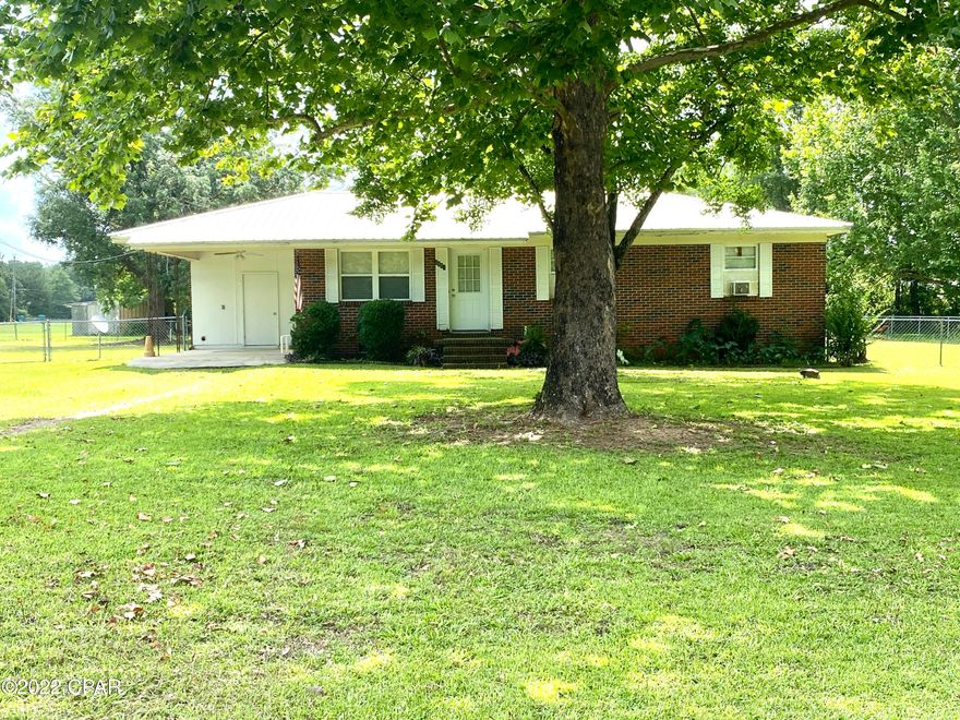Three bedroom/1.5 bath brick house with metal roof with hwy. frontage on a large .72 acre lot just 3 miles outside of town. The entire back yard is fenced with chain link. With a few updates and personal touches, you could make this your home for many years to come!