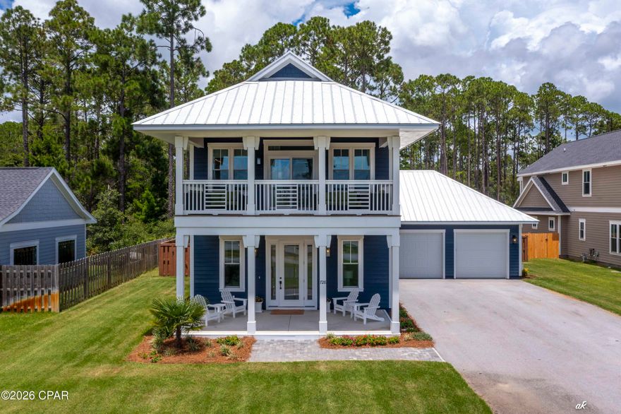 Tucked inside The Pointe at Lake Powell, this beautifully appointed four-bedroom home offers the perfect balance of indoor comfort and outdoor coastal living. Set just east of Inlet Beach and a short ride to both 30A and Camp Helen State Park, the location places you minutes from sugar-white beaches, boutique shopping, dining, and some of the best scenery the Emerald Coast has to offer. Sold fully furnished and turn-key, the home makes settling in effortless. The beach is just a fun short golf cart ride away, adding even more convenience to the laid-back lifestyle. With deeded access to a private boat dock on Lake Powell, days on the water are just a few steps from your door.

Whether it's a quiet paddle, a sunset cruise, or pulling up to the beach from the lake side, this is waterfront living at its best. Back at the house, the fenced backyard is a retreat of its own, featuring a sparkling pool, raised spa, and sun deck surrounded by lush landscaping.

Two levels of covered porches offer peaceful views of the lake and breezy spaces to relax with morning coffee or end the day with a coastal sunset.

Inside, the home opens to a spacious, light-filled layout with an open-concept kitchen, living, and dining area. The kitchen is designed for both function and entertaining, with a large center island, quartz countertops, stainless appliances, gas cooktop, walk-in pantry, and stylish lighting throughout. The main level also includes one of the two primary suites, with a luxurious bath, walk-in shower, soaking tub, and large closet.

Upstairs, the second primary suite offers its own private balcony overlooking the lake, while two additional guest rooms enjoy access to another outdoor deck with pool views. A shared Jack & Jill bath, ample closet space, and a convenient office nook complete the upper level.

The two-car garage and extended driveway provide plenty of space for vehicles and beach gear.

Whether you're headed out for a boat ride, entertaining by the pool, or exploring nearby 30A or Panama City Beach, this home delivers the full spectrum of laid-back coastal living in the perfect location.