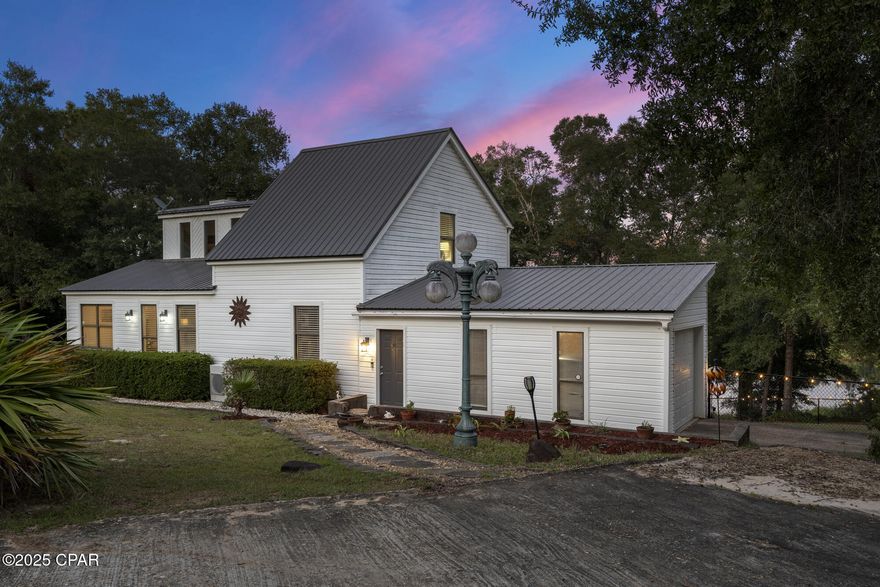 Stunning Lakefront Oasis on Payne Lake — Quiet Country Living with Gulf Access
Discover this tranquil lakefront retreat just outside Chipley,  a spacious, well-appointed home on 1.45 acres with direct Payne Lake frontage, blending peaceful country charm with easy access to the Gulf Coast and Tyndall Air Force Base.
Property Highlights:
Generous, open floorplan: Large windows throughout the main house capture breathtaking lake views and flood the interior with natural light. You'll find a modern kitchen, expansive living and dining spaces, several bedrooms, and full bathrooms.
Outdoor living at its finest: A big deck framed by mature oak trees overlooks Payne Lake — the perfect place to sip morning coffee, entertain friends, or simply absorb the serenity.
Flexible in-law suite: A separate efficiency unit with its own kitchenette, bathroom, and private entrance. Ideal for guests, extended family, or rental income.
Peaceful, private setting: Located on a quiet, maintained road — offering privacy, room to roam, and space for gardens, hobbies, or future additions.
Recreation on the lake: Kayak, paddleboard, fish, or observe wildlife right from your backyard. Payne Lake is a natural playground.
Location & Commute:
Panama City Beach: Approximately 53 miles (about 1 hour 5 minutes) away from Chipley. 
Tyndall Air Force Base: Roughly 61 miles (about 98 km) by road from Chipley. 
Panama City: Around 48 miles (about 57 minutes' drive) from Chipley. 
This makes the property especially appealing for those who want rural, lakeside peace without being isolated — whether you're commuting to Tyndall AFB, working in Panama City, or heading to the beach on the weekends.
Why You'll Love It:
 Ideal for multi-generational living — the in-law suite adds flexibility & value
A nature lover's dream — bring your kayaks, fish, or just unwind by the water
Military friendly — within comfortable commuting distance to Tyndall AFB
 Beach access — Gulf Coast adventures are just a drive away
 No HOA — more freedom to make this home you