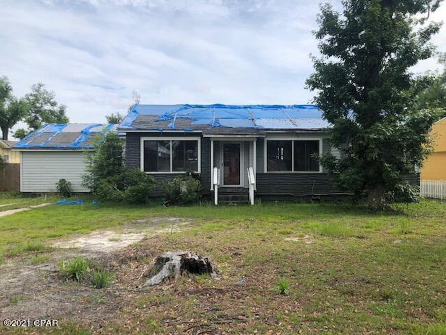 Hurricane Damaged Cove Home. This 3 Bedroom 1 Bath Home with traditional hard wood floors is ready for your ideas to make it come back to life! Quarter Acre lot with large back yard in the highly desirable Cove Area. Cash Only. Buyer to verify all measurements if deemed important.