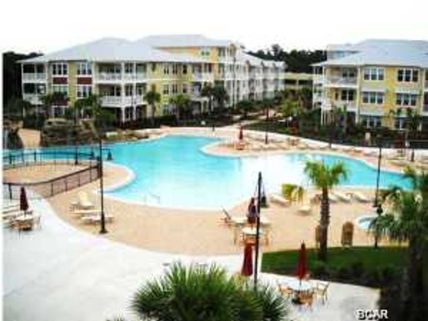 YOU WILL FEEL LIKE YOU ARE LIVING IN A RESORT..ONE of the ''Prettiest'' 2's IN COMPLEX & Ground Fllor Large Patio ... PERHAPS LARGEST POOL IN BAY COUNTY (1 acre) w/ two waterfalls, SPLASH PAD and spa plus numerous seating arrangements for your poolside entertaining... all on one level AND ELEVATORS AVAILABLE IN THE BUILDING This 2 bed 2 and a half bath unit is by far the best priced in Island Reserve. This unit has 2 Master Suites and each bedroom has a door to the large ground floor private patio overlooking the back close to the 1 acre pool There are floor to 10ft ceiling windows in the living room. Bamboo Floors and Granite Countertops throughout along with Stainless appliances make this hard to resist. The complex boasts an indoor H/C Basketball court along with a state of the