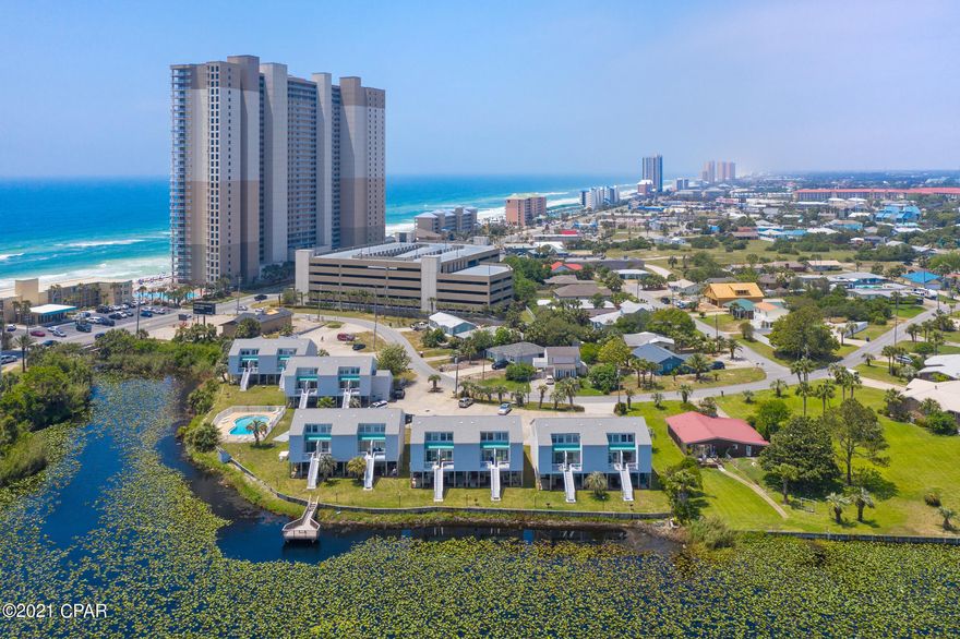 CURRENTLY UNDER CONTRACT, SELLER ACCEPTING BACKUP OFFERS. Welcome to your new Beach Condo! This ground-level, lakefront condo is located right across the street from the Gulf of Mexico on the popular West End of Panama City Beach! This studio beach condo is perfect for a second home, vacation rental, or for affordable long term efficiency living! You really can have it all here and not break the bank! Sit on your private back patio and watch stunning sunsets over the lake, or enjoy a dip in the community pool! Lullwater Lake Beach Condominiums is a low density complex with NO elevators! Owners have ample parking, a lakefront community pool, bbq grills, and the world's most beautiful beaches are only a short walk away! This unit is tastefully furnished, flat surface countertops, Luxury Vinyl Plank floors, stainless steel dishwasher, refrigerator, stove, with a lovely dining area, open concept living, and comes furnished and rental ready. Call today to schedule your private showing.