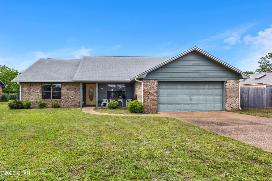 LOVELY BRICK HOME IN THE CANDLEWICK SUBDIVISION! This well-maintained 4-bedroom, 2-bath residence offers nearly 2,000 square feet of thoughtfully designed living space, featuring a split-bedroom layout and a semi-open floor plan that balances comfort and functionality.  The living room has a vaulted ceiling and a cozy fireplace with mantle and hearth, creating a warm and inviting focal point. Durable LVP flooring flows throughout the home. The kitchen is equipped with a pantry, elegant quartz countertops with a stylish backsplash, and a breakfast bar.  Enjoy both casual and formal dining with two separate dining areas. The oversized master suite includes a private bath with a jetted tub, double vanity, dedicated makeup vanity, separate shower, and a walk-in closet. The three additional bedrooms are good size and share a hall bath.  Exterior features include a charming covered front porch--perfect for seasonal decorations--a covered back porch, a privacy-fenced backyard, and a storage shed.  Located in the desirable Candlewick subdivision, the neighborhood offers sidewalks, underground utilities, and a welcoming environment ideal for walking and biking. Conveniently situated near quality schools, shopping, grocery stores, and everyday essential, this home is ready for you to see. Call today for a preview.  Measurements approximate.