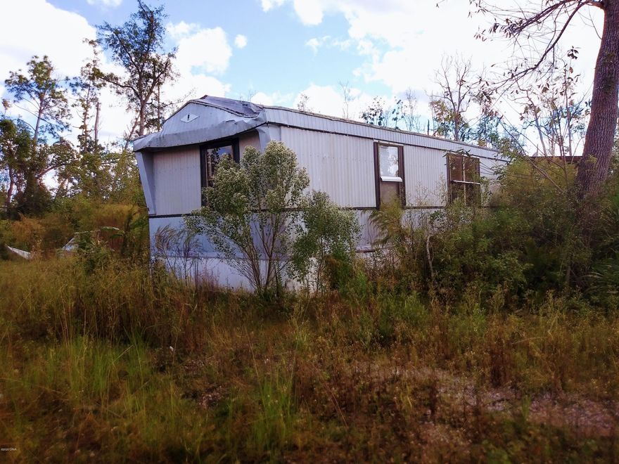 Sale includes adjoining property of 260 Charlene Dr.  Bay Co. Parcel:  06059-005-000 which could be a cul-de-sac setting.  2 water sewer hookups on Kimbrell.

A lot of land here and a lot of possibilities.  No value is given to the existing mobile homes.

Properties have metes and bounds descriptions; measurements given are approximations.