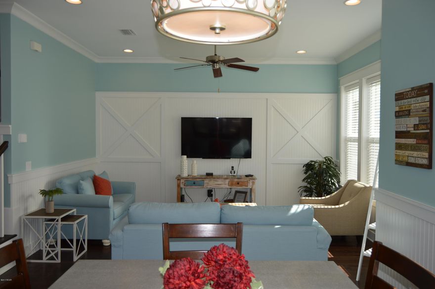 This unit has upgraded wood floors and tile throughout- no carpet. It is tastefully decorated and all decorations, furniture, and appliance are included. The home is located only 4 homes from the pool.