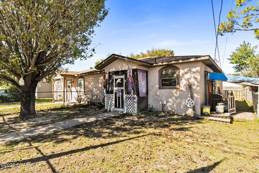 This 3-bedroom 2-bath duplex home has been exceptionally well cared for.  With tile throughout the main living areas, you will enjoy the roomy living room, dining room and kitchen with updated appliances.  The refrigerator is 2025, dishwasher (Bosch) is 2024, and stove is 2023.  There was a new roof put on in 2025 with Peel N Stick underlayment, HVAC was replaced in 2022 and the water heater in 2024.  The electrical panel is a Siemens and was replaced in 2024.  Even the bedroom windows were replaced.  There is a stand up freezer and washer and dryer that come with the home.  Each bedroom has a ceiling fan and has laminate flooring. The guest bath has a tub/shower insert and a single vanity while the master bath has a new toilet, walk in tub/shower and single vanity.  There is 6'' of insulation in the attic to help with the electric bill.  There is enough room to park 3 cars out front and due to the double gate in the front you can easily park a boat or camper in the front yard.  This is located next to Lucille Moore Elementary and is on a dead-end road for less traffic.  The city bus has convenient pick-up right on Michigan which is a nice feature.  The front and back yards are fenced and there is a small storage closet in the back yard.  There is a cluster mailbox at the end of the street.  Electric is through Florida Power and Light, Water/Sewer/Garbage is through City of Panama City and Internet/Cable is available through the main offerings (AT&T, Infinity and Wow).  Make plans to see this one today!