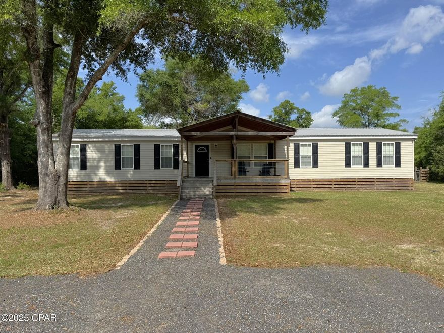 Experience the ultimate in comfort and convenience in this meticulously maintained mobile home, perfect for a seamless move-in. With four spacious bedrooms, two bathrooms, and two expansive living areas, this residence offers the ideal blend of relaxation and entertainment. The expansive master bedroom boasts an elegant en-suite, complete with a standalone shower and double vanity, as well as a versatile 10x12 office or nursery. Three additional bedrooms provide ample space, while a conveniently located guest bathroom features double vanities. Exterior highlights include a sturdy 24x36 pole barn, 10-foot eaves, and a fully fenced and cross-fenced yard, all situated in a serene setting. Recent upgrades include a seven-year-old metal roof and a one-and-a-half-year-old replacement coil for the HVAC system. A covered 18x12 deck provides the perfect spot to unwind. Strategically located between Dothan, Alabama, and Panama City, Florida, this home offers limitless possibilities and is eligible for all financing types. Please note that the shed in the backyard does not convey.