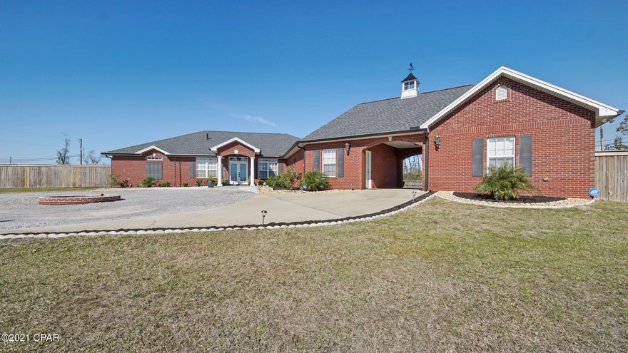 CURRENTLY UNDER CONTRACT, SELLER ACCEPTING BACKUP OFFERS. NO STEPS! LARGE FLOORPLAN! ROOM TO GROW! This is a MUST SEE property! Make sure to view the Matterport video in the virtual tour section. This can also be viewed on an Oculus or other VR headset for a great virtual tour experience! extremely large lot and home for Lynn Haven. You will not find another property that has been maintained as well as this one has. The seller has every piece of documentation from the or build all the way through the few hurricane repairs. So very detailed and organized! This beautiful home features so many details in the craftmanship. Side property  entrance to store all your toys, boat, RV so many options! 

3-Car garage (Finished w/9'-4'' ceilings)

(24'x16') Each garage has access door w/ladder to the  Pocket doors, beautiful glass door knobs and eye catching chandelier's. (Red Oak)Harwood floors in Hallways, Dining Room and Great Room. Wayne's coating in hallways & Dining Room. Ceiling fans in all bedrooms, Crown Molding, 6-Inch, Baseboards w/quarter round, 4- Tray Ceilings (Foyer, Great Room, Dining Room, and Master Bedroom), 2-Inch White FAUX Wood blinds on all
windows. RAINNI tank-less HOT water system x2 (GAS + elect) Exterior: Shield (14x12), Doublewide Entrance for boat, RV, trailer, or large truck (Entrance on 24th Street), Manuel Electrical Bus Switch, 30 Amp socket for RV or Pool, Exterior Power outlets