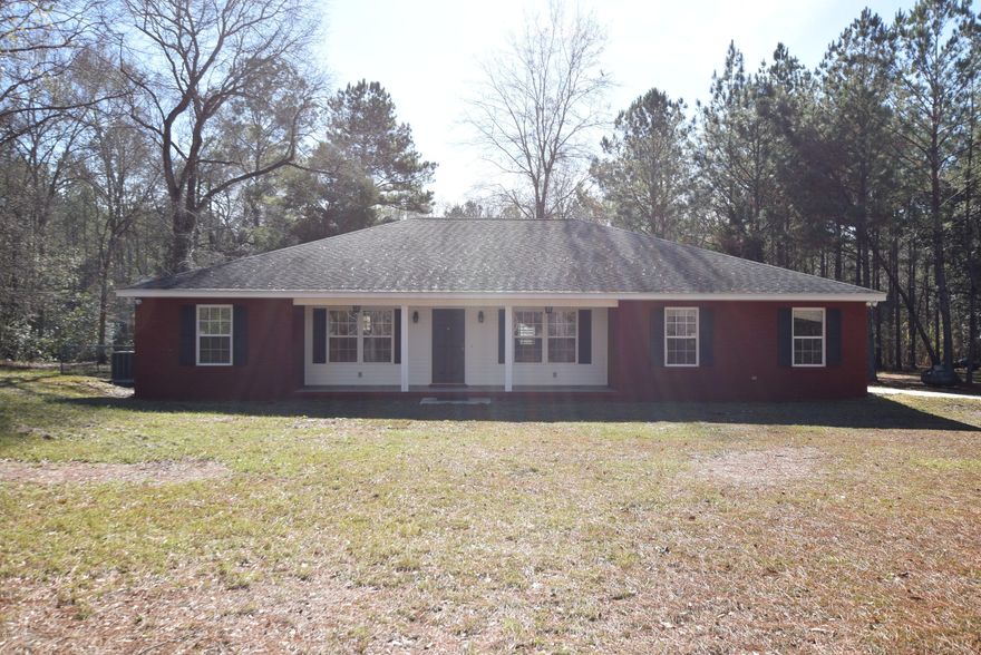 Country life! Yet this property is only 2  miles from Vernon, 35 minutes to Panama City Beach, and 15 minutes to Chipley. Spacious brick home with 3 bedrooms, 2 baths, and an Office.  The master bedroom is over-sized with 2 walk in closets.  9ft ceilings in the living areas and office.  Covered front and back porches.  1 acre of land with recent survey.  Expansive chain link fenced back yard. 15 kW generator to boot! You won't find another home like this at this price anytime soon.  Make your appointment today! All measurements are approximate, verify if important.