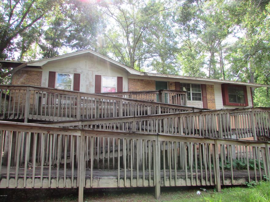 Located in Blountstown City Limits sits This is an Investors Dream! This home needs work but could be a great family home! Brick 3 bedroom 2 bath with 1279 sq ft located on .20 acre! Priced to SELL so call today!!