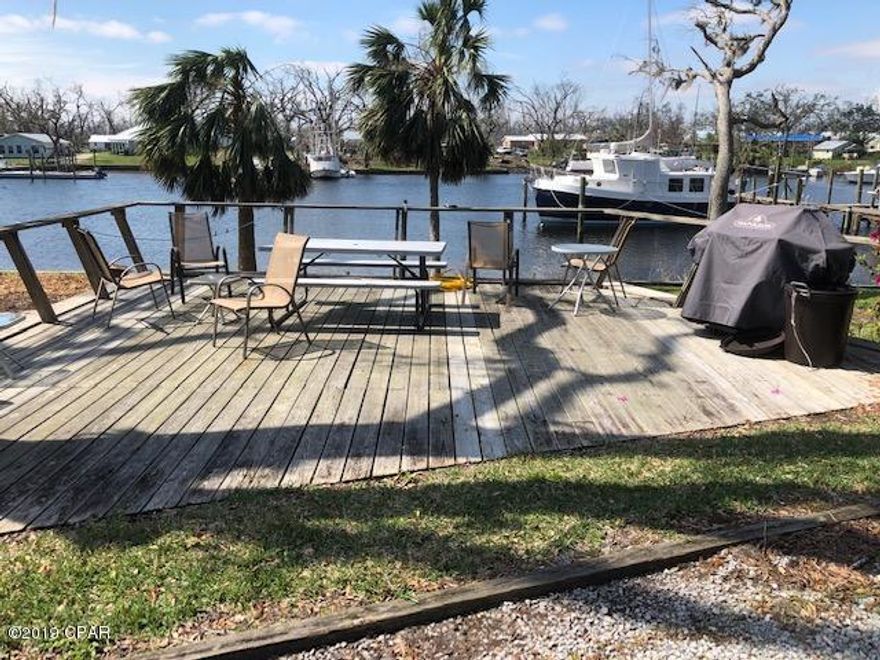 MARINERS COVE was built by out of town boat owners needing deep water for their Sail Boats in a well protected harbor plus a place to stay while in town. Unit F is the only end unit which boasts THREE WATER VIEWS, North, West and South right out of the Bayou to East Bay! Plus your own boat slip, use of the dingy rack TWO storage/work sheds and a community laundry. There are two common use decks for cookouts, sunset cocktails and a well maintained green area. Perfect for empty-nesters, USAF Folks stationed at Tyndall, Newly Weds or just relaxing in a beautiful little spot...oh and did I mention boating?