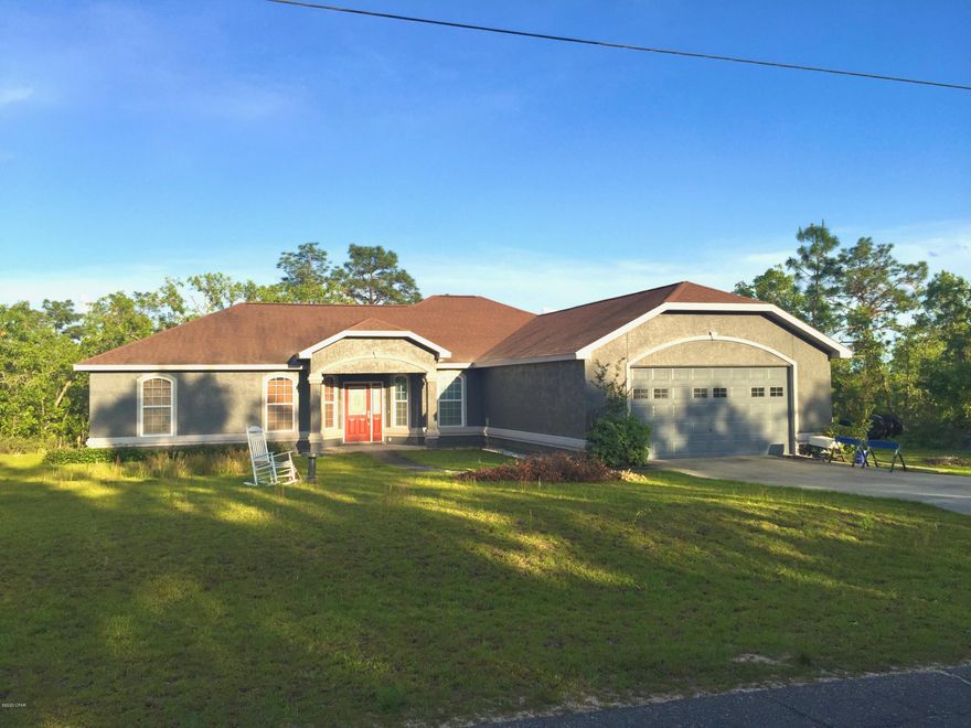 UNDER CONTRACT.  SELLER ACCEPTING BACK UP OFFERS.    Beautiful Custom Built Home is located in your on Private Oasis in a Golf Course Community offering Lakes, Parks and shopping.  You get the Best of both worlds...Country Living, but only 20-25 minutes to Panama City, Panama City Beach, and Dothan.  As you walk through the beautiful covered entryway into the large open concept living area with 9' to 15' ceilings you will immediately see that this home is perfect for large families, family gatherings and entertaining.  Attention to detail shows throughout this custom designed home from the quality paint to the cherry wood flooring in living areas, ceramic tile in entry way, kitchen, bathrooms and laundry room. The beautiful window treatments and shadow box accents above the doors, chair railings, tinted windows and screens, very large bedrooms and extra large bathrooms.  The spacious eat in kitchen offers maple cabinets, stainless steel appliances, hands free faucet, large farmhouse sink, walk in pantry, and breakfast bar.  Each of the bedrooms offer their own unique features.  The huge master bedroom is located on the opposite side of the house and is an oasis with 5 windows to enjoy incredible sunsets, or just step outside onto the covered deck through your own private door.  This very large bedroom also offers a sitting area and plenty of room for a king size bed, large dresser and chest of drawers, a walk in closet and a 2nd large closet.  The master bath boasts a huge soaking tub, an oversized custom shower, his and her sinks and a private potty. The other spacious bedrooms offer cherry wood flooring, chair rail, 2 tone paint, and custom window treatments.  ALL of this on a HUGE DOUBLE LOT 200'W x 300'D.  You really must see this home to fully appreciate it! So call your favorite Realtor today to schedule an appt to see this Incredible Home!!  All sizes are approximate, please measure if important.