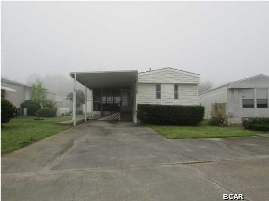 Singlewide mobile home offers a formal living room, split planned master suite w/full bathroom, kitchen/dining combo that opens to a sunroom, screen porch w/hot tub, and both bathrooms are handicap modified! Super convenient location tucked in between Panama City Beach Pkwy., and Front Beach Rd-meaning super easy access to tons of amenities and restaurants, plus you are just a few minutes from the bay, the beaches, and Saint Andrews State Park! *This is a 55+ community with no children allowed. EQUAL HOUSING OPPORTUNITY.