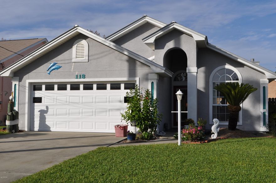 Fabulous 3BR/2BA Open Sands home with a  pool!  You're also just a few blocks from the beach and this is a golf cart friendly community.  This home has been updated recently with hardwood floors and porcelain tile, and a metal roof put on in 2010.  The saltwater pool also just got some upgrades with a new pebble designed liner, lights, drains and ladder.  There's even a hot tub in the privacy fenced backyard!  The interior boasts an open floor plan and split-bedrooms. Features include an eat-in kitchen with added custom cabinetry, a vaulted ceiling in the living area along with a fireplace.  The two car garage also has some custom built cabinetry for extra storage.  Move-in ready home in a great location!  All info is approx. and must be verified by Buyers if important.