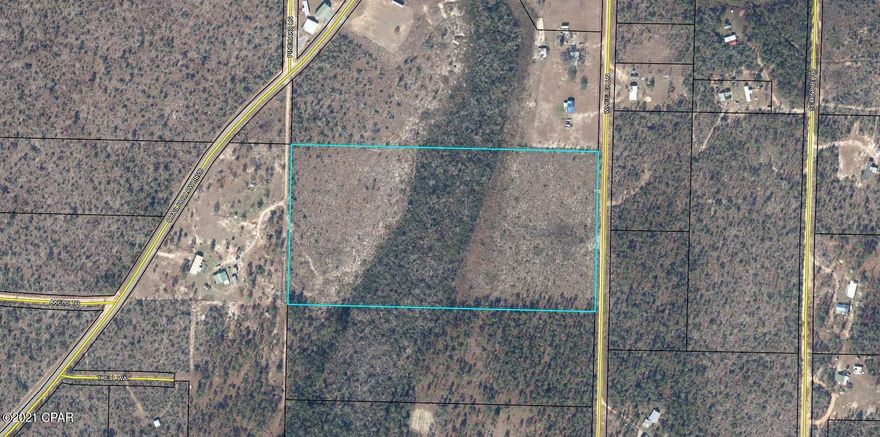 20 acres of unrestricted property in the Country Oaks community. Not too far off a paved road. Great place to build your new home or place your manufactured home. Property appears to have a small stream running through it.