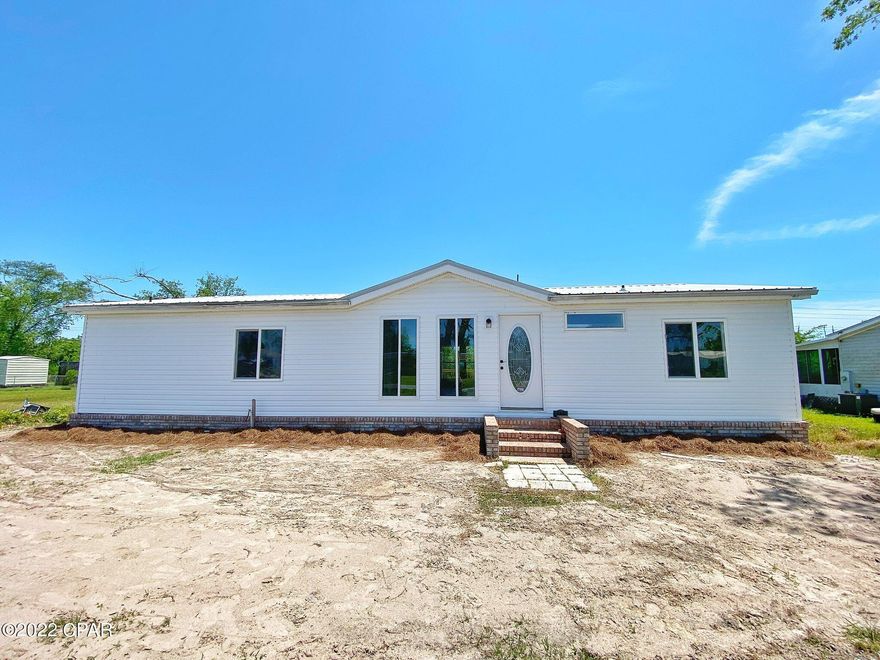 This Mobile home has been totally and professionally remodeled from top to bottom.  Kitchen is spacious and has granite top counter and stainless-steel appliances.  The guest and master bathroom have marble walls and a walk-in closet with laminated waterproof floors.  The L shaped deck gives a peaceful and relaxing feel enjoying leisure time and looking into nature.  You may add a pool in the big backyard in order to enjoy more of those relaxing activites including BBQ's in the wonderful and awesome place to call HOME.