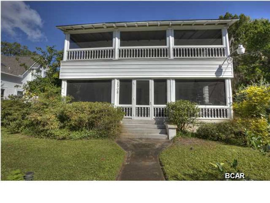 *****MAJOR PRICE REDUCTION!!!!****PERFECT FOR A BED & BREAKFAST********Bay front historic home located on the less traveled west end of Beach Drive...Built in 1912 and known as the first Mayor of St Andrews home...features include formal living room, formal dining room, gathering room, family room, updated kitchen with granite, two dishwashers, two ovens, two refrigerators, two sinks, plus butler area...other rooms include playroom/den, three downstairs bedrooms, three upstairs bedrooms, plus craft room. Exterior features, two downstairs covered and screened porches, one second level covered and screened porch, corner lot, carport, and pool. Included in sale in lot across Beach Drive located on St Andrews Bay. Home is being sold AS IS.