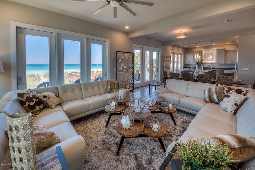 Recently completed stunning beach front property offers ultimate escape. This is a rare opportunity to own a stunning newly completed beachfront home in popular Panama City Beach. At just under 4,000 square feet, this meticulously designed 6 bedroom, 6 1/2 bath property is the ultimate vacation paradise boasting extraordinary views, top quality finishes throughout and just steps from one of Florida's most breathtaking beaches. This one of a kind residence features a downstairs in-law suite which offers complete privacy and easy access as well as large master bedroom and two guest rooms with panoramic gulf views. Entertaining is easy with the modern kitchen, complete with two dishwashers and top appliances, two laundry rooms, and a gracious open floor plan that provides plenty of room for family and friends. From the back deck or upstairs terrace, enjoy the cool ocean breezes and breathtaking sunsets while being mere feet from the sugar white sandy beach and clear turquoise waters.