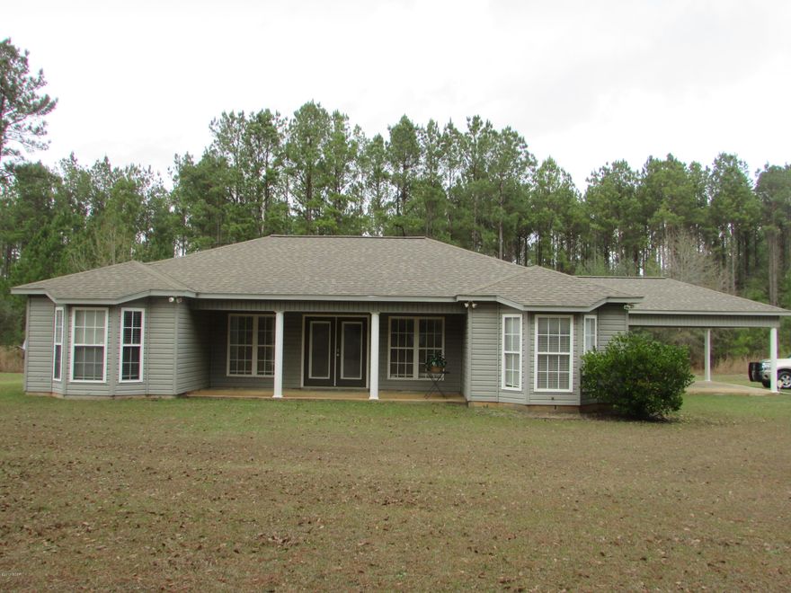 Very nice, like new, 3 br. 2 bath home located in a country setting. Built in 2009 having 1736 sf heated and cooled!

Large living room with French doors leading to the front covered porch and 

a covered rear veranda! Open kitchen design with Breakfast bar. Master Br. has bay window and bath has double sinks. Two car attached carport, detached storage building with loft.

Move in ready. The home is protected by an ADT security system.