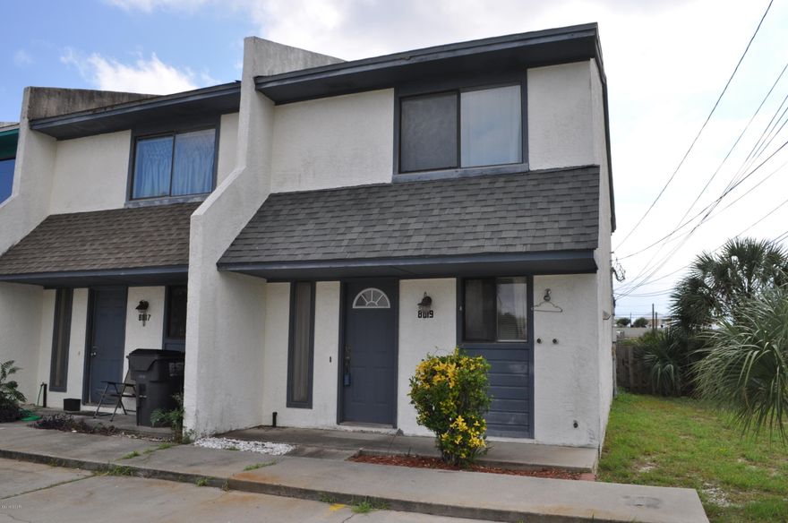 Move-in ready townhome in fabulous location, just a short walk to the beach! This is an end unit townhome with 2BR/1.5BA that has been updated.   Downstairs you'll find Tuscan style cabinets and stainless steel appliances in the kitchen, tile flooring in the kitchen, dining and half-bath, and French Pella style doors open to the covered patio and privacy fenced backyard.  On the second floor you'll find both bedrooms and the full bath.   French Pella style doors in the Master Bedroom open to a private balcony where you can enjoy a great view of sunsets!  You're only two blocks from Beach Access 16 and a 5 minute drive from shopping, dining, golfing and St. Andrews State Park!   All info approx. and must be verified by Buyers if important.