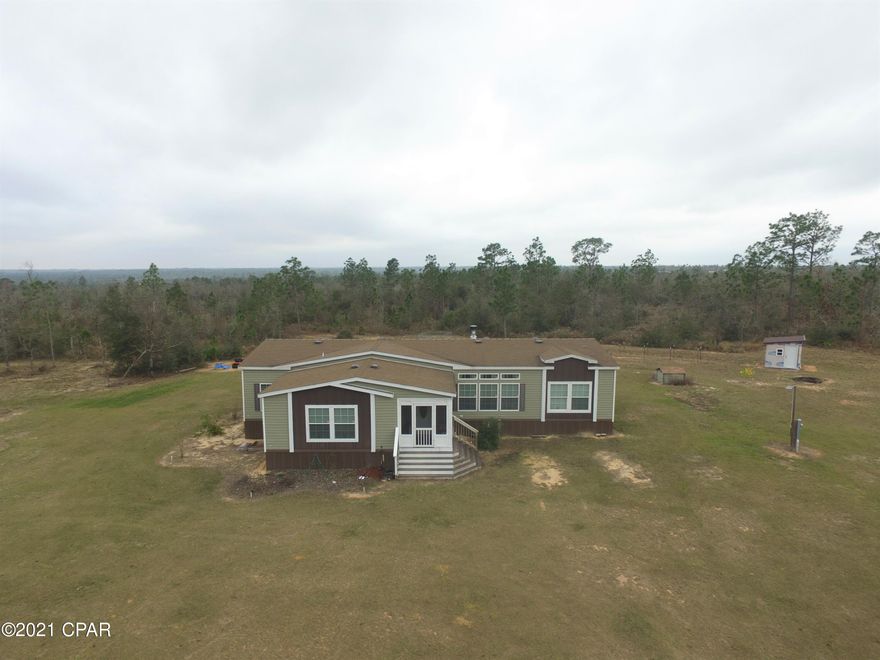 CURRENTLY UNDER CONTRACT, SELLER ACCEPTING BACKUP OFFERS.  Beautiful 3/2 2018 triple wide with over 2350 sq ft heated and cooled.  Home is built by Biltmore by Live Oaks with sheetrock walls and 2x6 construction, sits on beautiful private, rural 9.6 acre lot with deeded access to beautiful Silver Lake.  Deep well, septic. This home is in like new condition and move in ready.  There is an additional 10 acres that adjoins this property that can be purchased at agreed upon price.  If you ordered this home brand new for the dealer it is currently being sold for over 200K and has a six to eight month waiting period.  There are two parcels that come with your purchase.  Sellers are in the process of moving.  Make your appointment today.