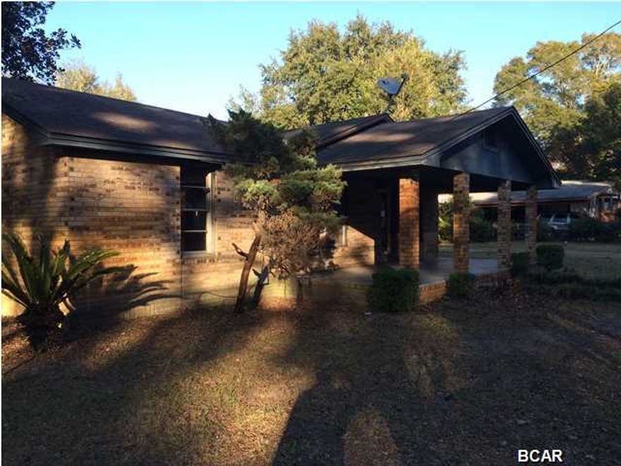 This brick home sits on a triple lot. It has a large front porch and a detached 22x40, 2 car garage and storage room. The yard is fenced in and large with lots of mature landscaping. There is a breakfast area off the kitchen as well as a dining are off the living room.Plenty of space for RV's, boats, and lots of parking.