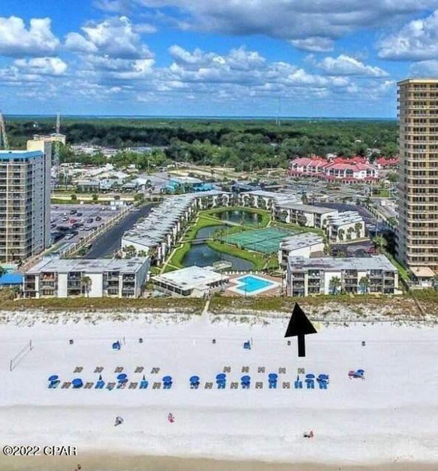 *9/16/22* CURRENTLY UNDER CONTRACT, SELLER WILL CONSIDER BACKUP OFFERS The best kept secret in PCB - low volume and low rise condos and this one is BEACH FRONT!  2B/2B first floor unit with a covered patio.  Updated luxury vinyl plank flooring, stainless appliances, bathroom vanities, furniture, and paint. This unit is available fully furnished and turnkey ready to rent with sleeping arrangements for up to 8 people. This unit is situated beside the pool and private beach access. Sugar Beach is a beachside community with a pool, pond, tennis courts, shuffleboard, barbecue patio, community room with public restrooms adjacent to the pool, and hundreds of feet of dedicated beach.  This complex allows owner and renter pets. A rare find in our area. Come see this today!