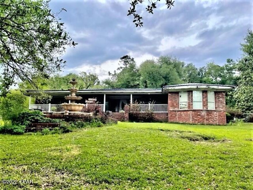 Lovely brick home on 12.44 acres with a small lake.  Location is near all Marianna Schools and is perfect for large family.  Home features split bedroom design.  There is a living room, den with fireplace, dining room and roomy kitchen.  There is an inground pool, pool house and a barn on the property.
