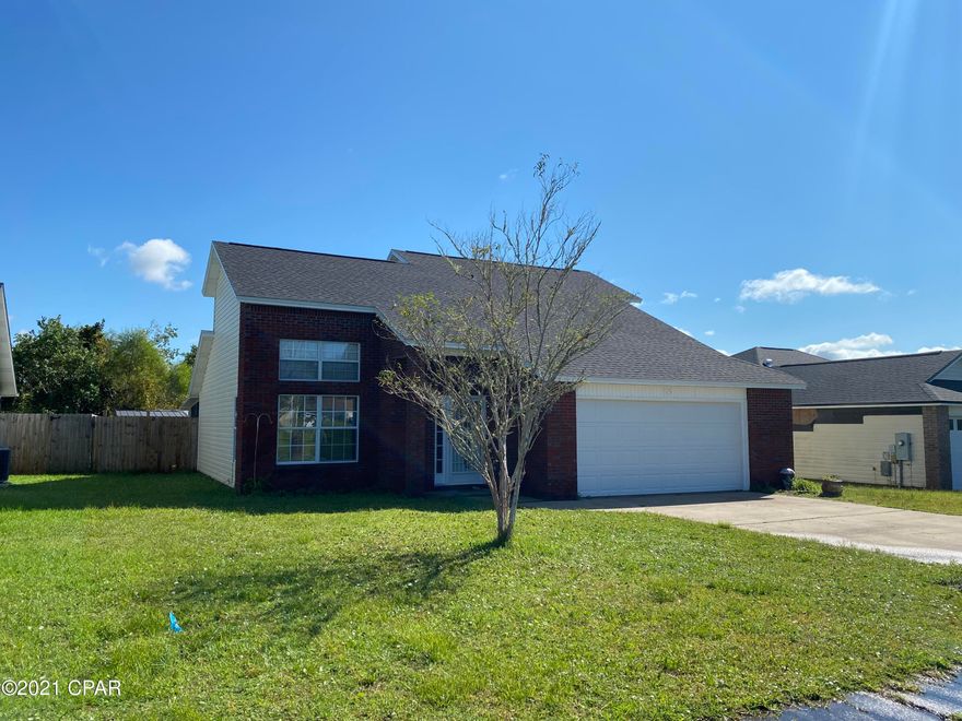 This contemporary two-story fenced home consists of over 1400 square feet and offers plenty of windows and natural sunlight. As you enter this home, you will find traditional 17' ceilings, vinyl sheet flooring throughout the common areas, a master bedroom off the great room, and an enclosed patio. The  kitchen offers tiled back-splash, granite countertops and updated stainless steel appliances. The great room is open and spacious.  Upstairs is 3 additional rooms and a full bathroom. The roof, water heather, and air conditioner were recently updated.   Located close to restaurants, shopping and Tyndall Air Force Base.  Please verify any information for accuracy.