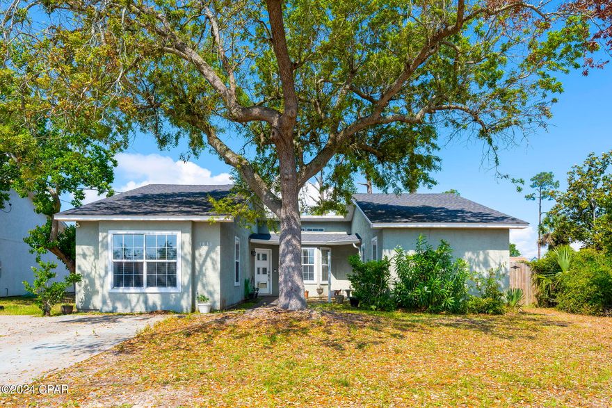Welcome to 1833 Lake Avenue, nestled in the heart of Panama City, just a stone's throw away from FSU Panama City and St Andrews Bay. This charming home offers the perfect Florida lifestyle, with a prime location only 25 minutes from Tyndall Air Force Base and a mere 15-minute drive to the breathtaking Gulf of Mexico beaches, boasting powder-white sands and emerald-green waters.

As you step onto the property, you're greeted by a sprawling yard adorned with majestic oak trees, offering both shade and tranquility. The sizable fenced backyard provides ample space for outdoor activities and relaxation.

Stepping inside, you're welcomed by the warmth of the interior, accentuated by a cozy brick fireplace in the living room, setting the perfect ambiance for cozy evenings. The kitchen and dining area are thoughtfully designed for both culinary endeavors and entertaining guests.

A notable feature of this home is the converted garage, now a spacious bedroom that offers versatility, whether utilized as a guest suite, office space, or play area.

Privacy is paramount, with the other two generous bedrooms situated on the opposite side of the house.

Practical updates include a roof replacement in 2018, ensuring peace of mind for years to come. Additionally, the kitchen cabinets have been recently refaced and painted, adding a fresh touch to the heart of the home.

Don't let this opportunity pass you by - here's your chance to own a well-maintained, affordable piece of paradise in Panama City, conveniently located near the beach and all the amenities this vibrant area has to offer. Schedule your viewing today!