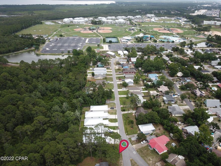 Great property to build your new home! This lot is only a 3-minute walk to Frank Brown Park, through the new trail ''Escanaba Way''. Frank Brown boasts a brand-new playground, soccer and baseball fields, basketball courts, dog park, 2 swimming pools at the aquatic center, bike trails, lakes and much more! Take advantage of all the amenities without any HOA fees! No septic tank required. This lovely neighborhood is a ''goldmine'' for all utilities, per the city. You are also only a 2-minute (without traffic) drive or quick golf cart ride to the shopping mecca Pier Park, and the emerald beaches. Lots in this area go quickly. Don't miss your chance to buy in a GREAT location!