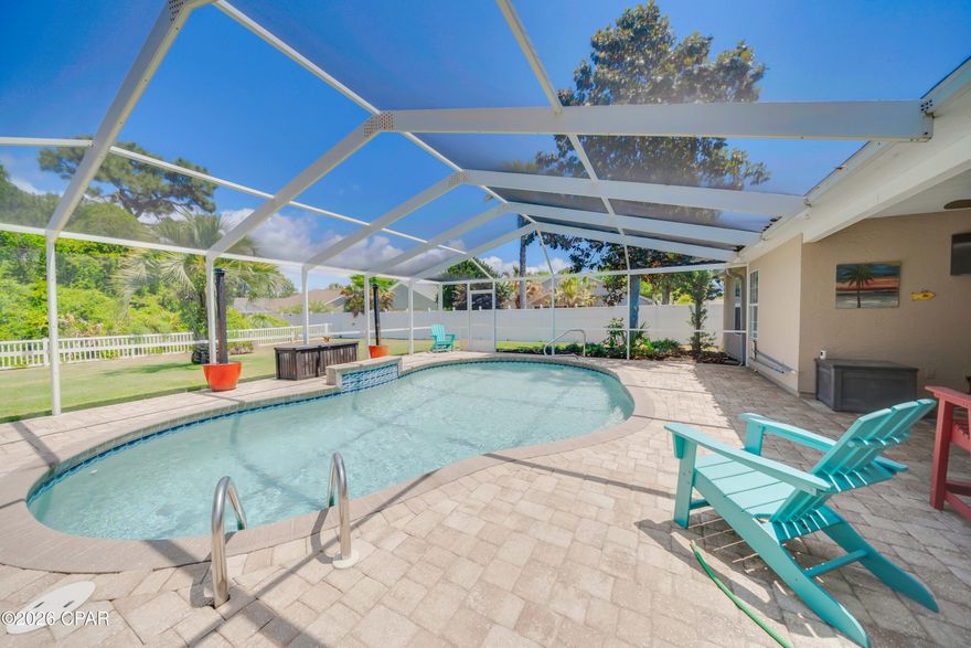 Now available in Palmetto Trace, this beautifully updated 4-bedroom, 2.5 bath home with a private screened-in pool!  This is one of the most desirable homesites in the community. Backing to a serene nature preserve, this property offers exceptional privacy with no rear neighbors. This move-in-ready home showcases fresh interior and exterior paint, a roof less than 4 years old, luxury plank flooring, newer HVAC, and new pool equipment. The updated kitchen features brand-new cabinetry, while the renovated primary bath offers a stunning walk-in shower. A split-bedroom floor plan provides added privacy, and two separate living areas create flexible space for both relaxing and entertaining. Additional highlights include plantation shutters, a covered porch, and a spacious backyard. Residents of Palmetto Trace enjoy access to two community pools and a prime location just minutes from the  beaches of Panama City Beach, an easy golf cart ride away. You're also close to Pier Park, Topgolf Panama City Beach, and Frank Brown Park, along with top shopping, dining, and entertainment options. A fantastic opportunity to own an updated home with highly desirable location in one of Panama City Beach's most sought-after communities. Truly move-in ready, call us for your showing today!