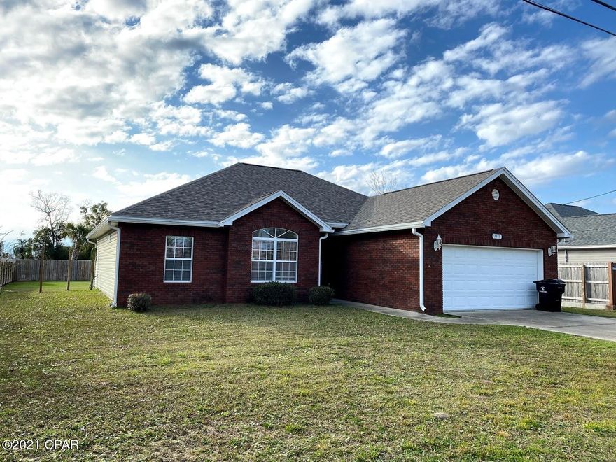 CURRENTLY UNDER CONTRACT, SELLER ACCEPTING BACKUP OFFERS Come see this beautiful brick home on over one quarter acre! 3 bedroom, 2 bath split floorplan with spacious rooms and cathedral ceiling in the living room. Beautiful maple kitchen cabinets with stainless steel appliances. Tiled foyer, kitchen and baths with carpet in bedrooms and living room. Huge backyard for entertaining or toys. Sprinkler system is on a separate meter. Very convenient to Tyndall and Panama City shopping!  Don't delay! Priced to SELL! Please be Covid-considerate and wear a mask. Lysol wipes for doorknobs available inside front door.