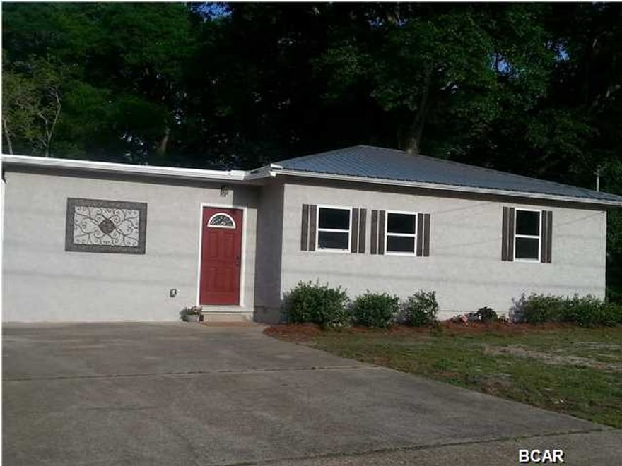 CHARMING ST ANDREWS COTTAGE completely renovated and MOVE IN READY for new owners. Recently refinished hard wood floors CREATE an inviting first impression and the OPEN FLOOR PLAN makes the most of the space. The updated kitchen features custom cabinetry, tile floors and STAINLESS APPLIANCES. The large bathroom was redesigned to include a large tub and double vanities. The 3rd bedroom could work a den and has glass doors leading to a cozy porch and private yard. This professional renovation includes a NEW METAL ROOF, all new plumbing and electrical, and an ON DEMAND HOT WATER HEATER. The large back yard has a carport and storage area. The seller has a complete home inspection, 4 point, wind mitigation and WDO available to buyers. This home offers lots of charm and value!
