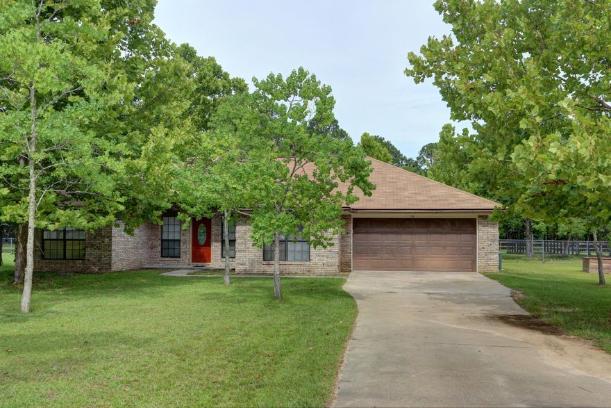 Amazing 3 bedroom 2 bath all brick home situated on 3.77 acres of the most beautiful land you have seen.  Home is in immaculate condition and ready for it's new owners!!  This home has had major renovations recently and they include but are not limited to: new roof, exterior and interior of the house has just been freshly painted, new garage refinishing and door opener, new refrigerator, dishwasher, trash compactor and range hood, new compactor, new master bath shower, new windows, doors, and flooring in the entire house is new. You will feel home the moment that you enter this home, with it's 10 ft ceilings, very spacious floor plan and beautiful fireplace complete with a antique walnut mantle.  The cook in the family is going to love this kitchen it offers a very large pantry, New appliances, oak kitchen cabinets, plenty of counter and storage space, breakfast bar which flows into the cozy breakfast nook.  All bedrooms are very spacious and have walk in closets providing for even more storage, master has French doors which open to the patio making it a perfect place to enjoy your morning coffee.  The master suite has separate vanities, new shower, Jacuzzi tub, and then you won't believe the 16x8 HUGE walk in closet. it is simply amazing. Bring your horses and motor home.  There is a 2 horse barn, horse feeder stable, 12x20 aluminum shed complete with electricity, 36 ft. boat/camper port with electricity, this house really does have it ALL!!  There is so much land that the possibilities are endless.  You will find this property has all the comforts  of country living yet just minutes from shopping, hospitals, restaurants and so much more.  Call for your private showing today.  All ages, sizes including sq. ft. are approximate measure if important.