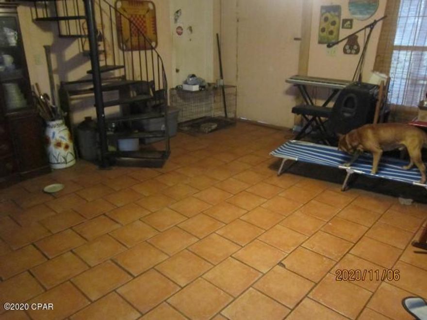 The propety consists of a 6.3 acre parcel of land with a rustic 1496 square foot board and batten, 2 story house built in 2004.  The foundation is a concrete pad and the upstairs consists of the master bedroom and master bath, with garden tub and separate shower.  Exterior access to the upstairs is an outside stairway to an 8 x 6 balcony entrance.  The inside access is a spiral staircase from the living room area. Downstairs is the kitchen, dining, living open area, 2 bedrooms and the guest bath.  The house is in need of a major cleanup and some repairs.  There is both a front and rear porch measuring 8 x 34 feet accross front and back of house.  The lot is mostly wooded except some cleared pasture around a dilapidated metal barn, that needs some rebuilding.  There is an aboveground pool that is old but appears to be salvagable, and is full of water at present but not maintained. Property needs work but could be transformed to a nice property.  Road frontage on two sides of property, Woodymarion on East side and Coyote Trail on West side. Bring Offers.