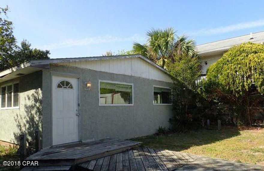 Two homes on one lot. House view from street is a two bedroom two bath stucco home. the guest house in back consist of two beds, one bath and bonus room. Both homes needed a considerable amount of repairs and would be deemed to be in fair condition.